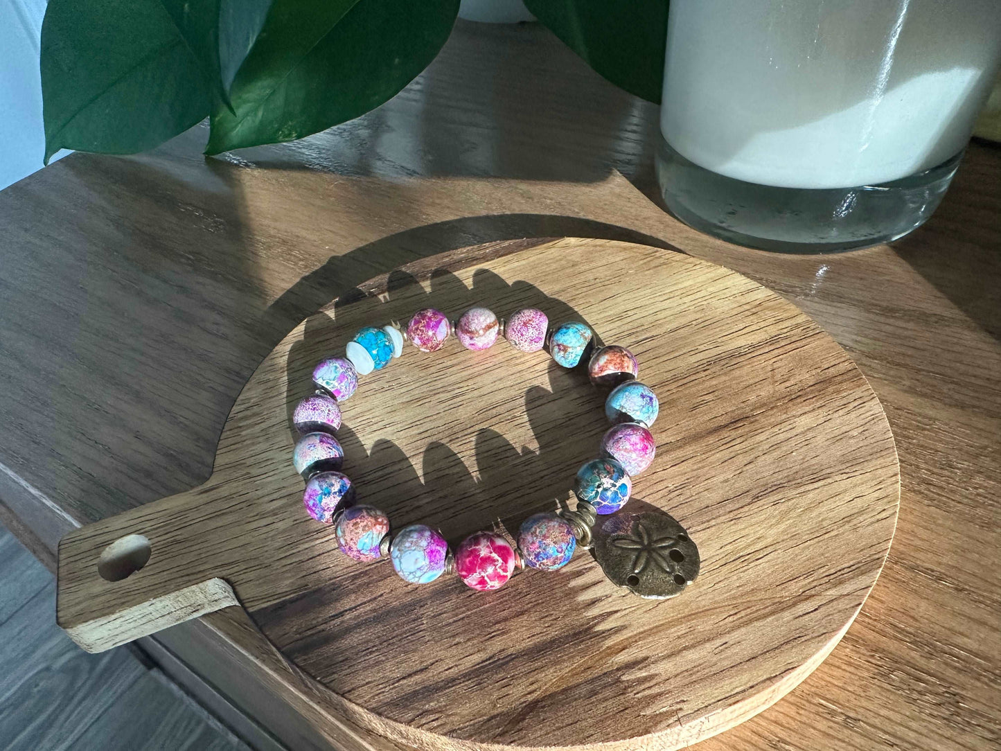 Colorful beaded bracelet with sand dollar charm