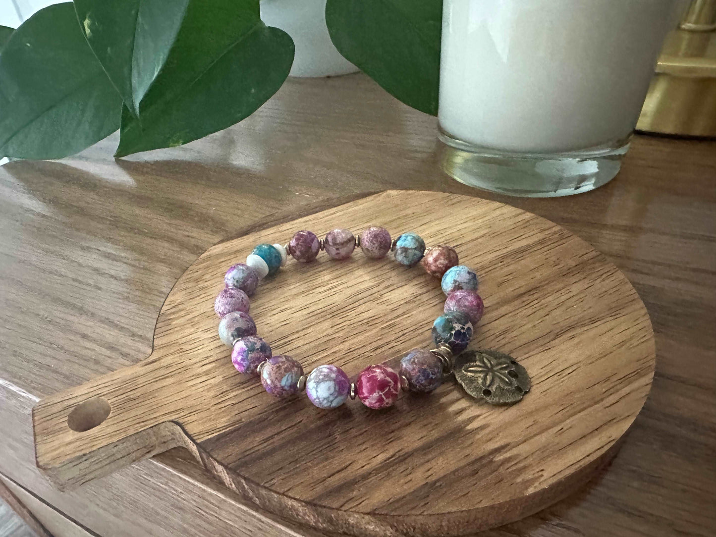 Colorful beaded bracelet with sand dollar charm