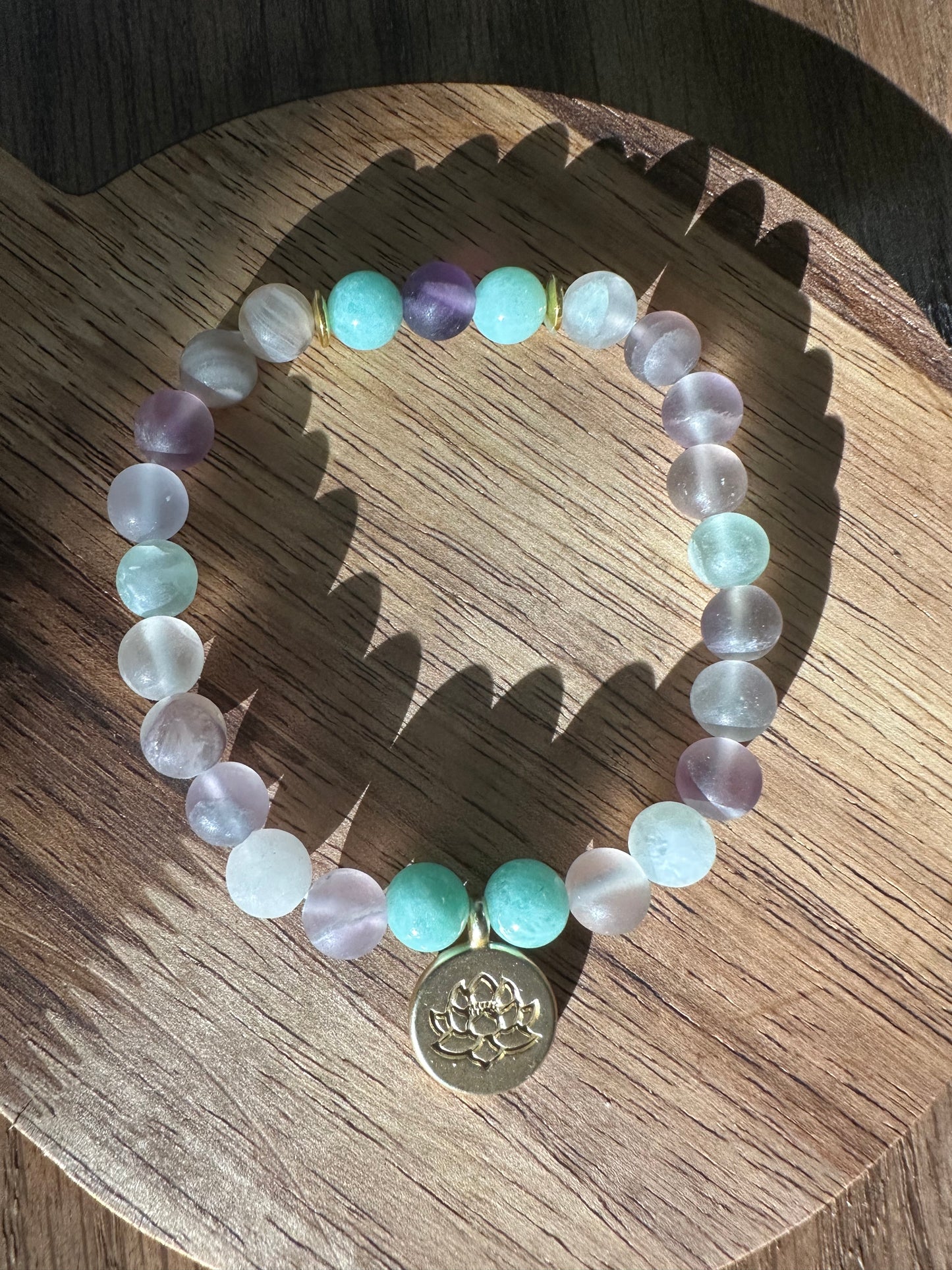 Pastel bead bracelet with lotus charm