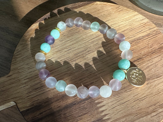 Pastel bead bracelet with lotus charm