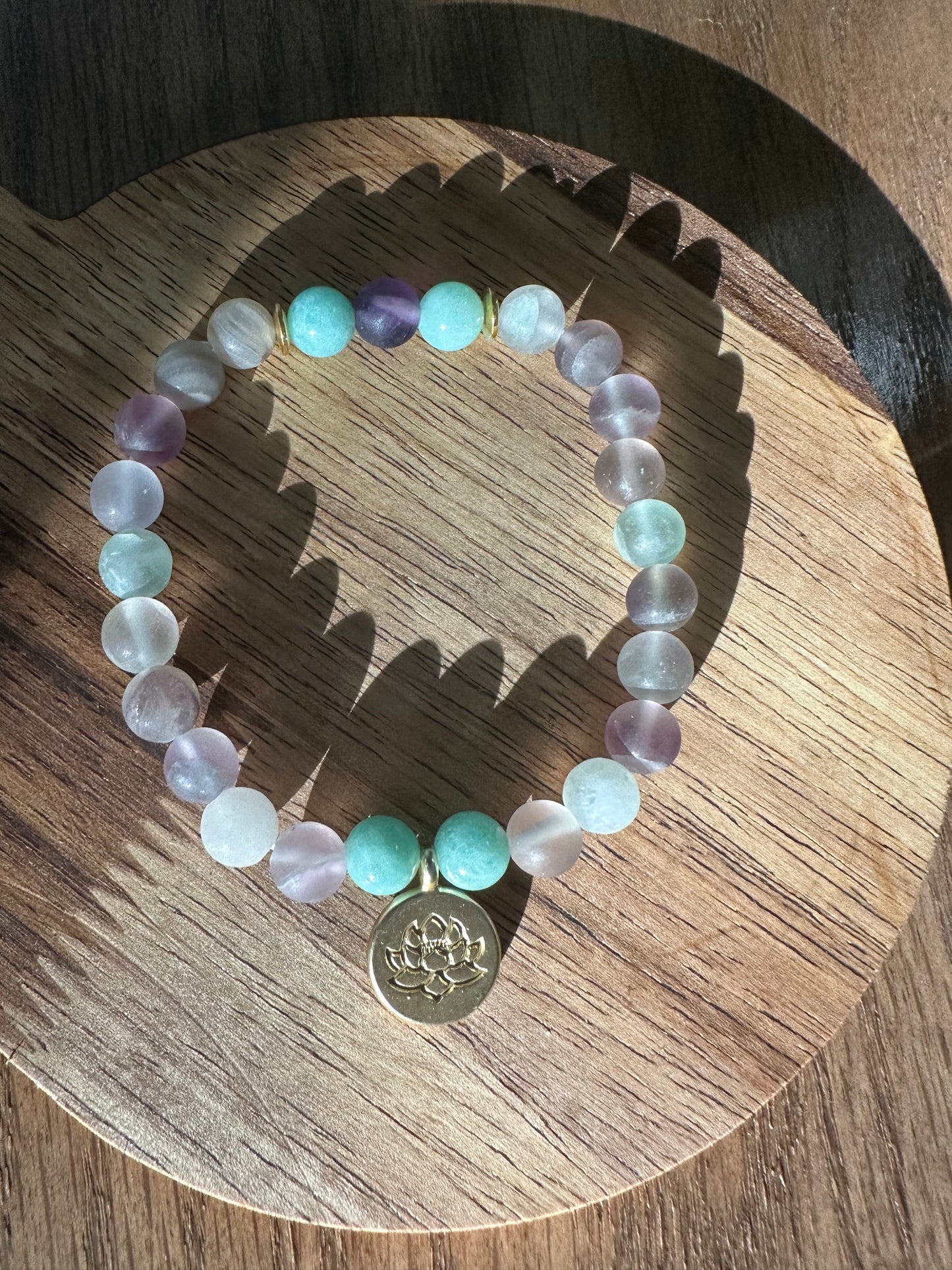 Pastel bead bracelet with lotus charm