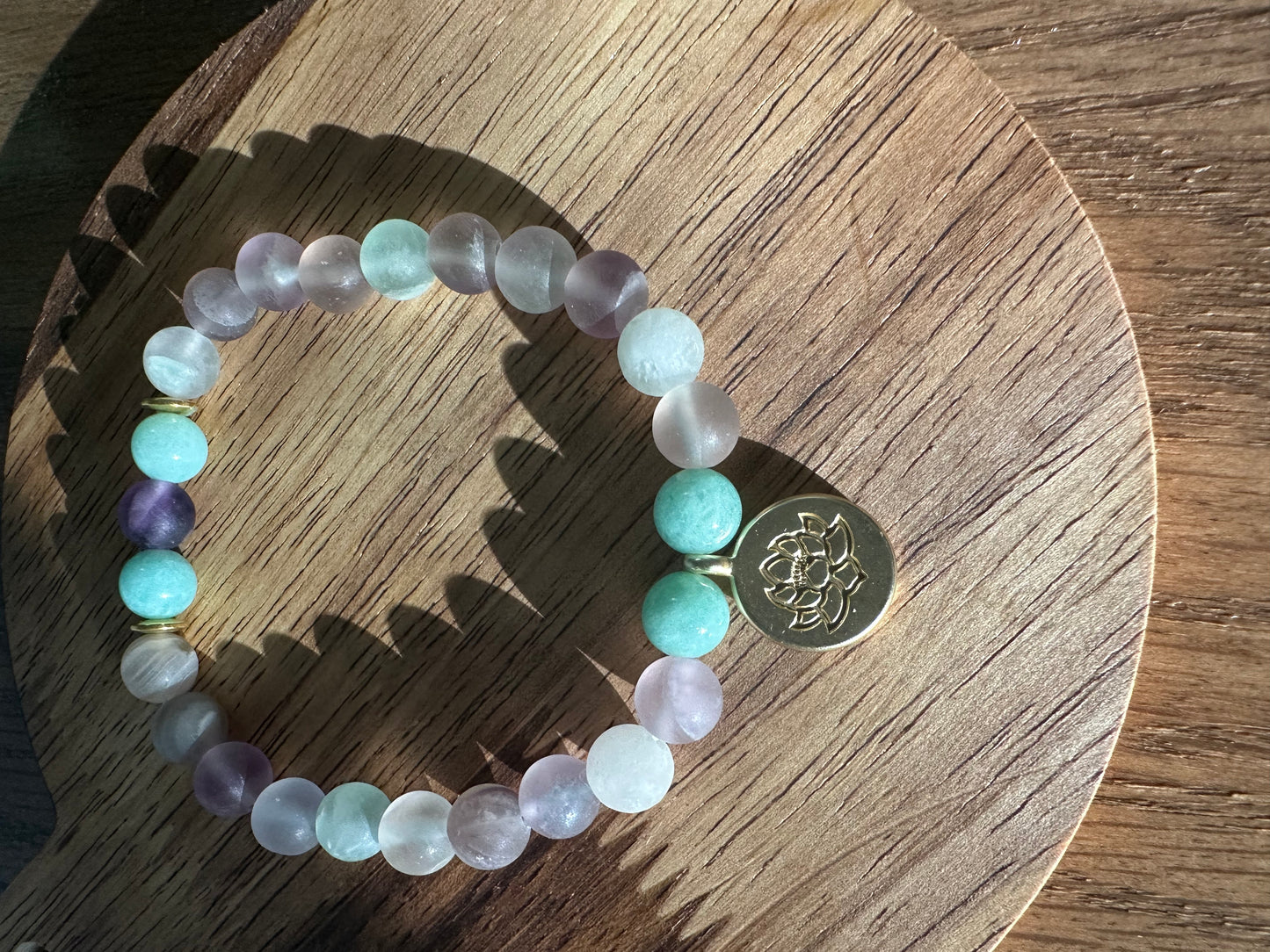 Pastel bead bracelet with lotus charm