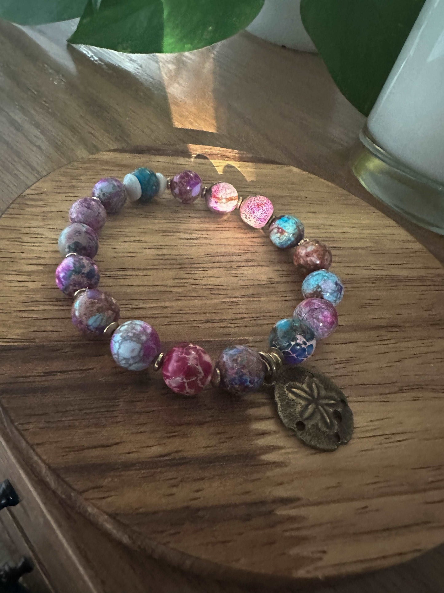 Colorful beaded bracelet with sand dollar charm