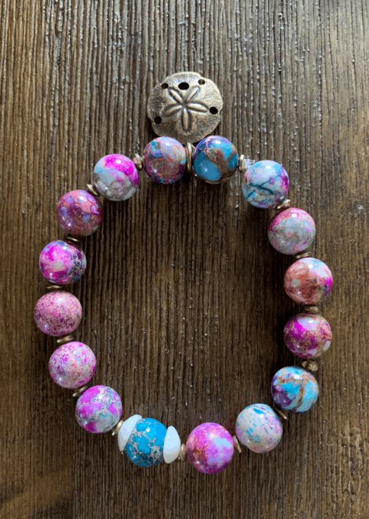 Colorful beaded bracelet with sand dollar charm