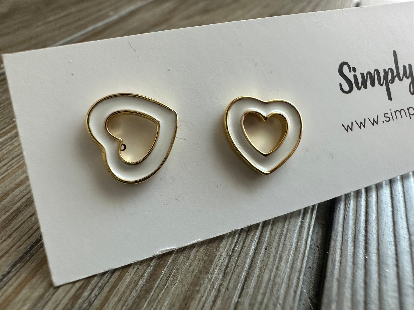 Timeless heart studs in white